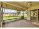Spacious screened-in lanai offering views of the expansive backyard at 4223 Oakhurst E Cir # 3025, Sarasota, FL 34233
