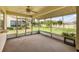 Screened-in lanai overlooking a lush green backyard at 4223 Oakhurst E Cir # 3025, Sarasota, FL 34233