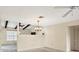 This living room boasts an open floor plan with neutral colors, ceiling fans, and an elegant chandelier at 4223 Oakhurst E Cir # 3025, Sarasota, FL 34233