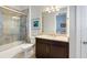 Bathroom with glass shower doors and a brown vanity with marble countertop at 4790 Pastel Ct, Sarasota, FL 34240