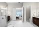 Bright bathroom featuring an open doorway to a bedroom in the home at 4790 Pastel Ct, Sarasota, FL 34240