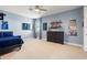 Bedroom with gray walls, neutral carpet, ceiling fan and sport themed decorations at 4790 Pastel Ct, Sarasota, FL 34240
