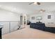 Upstairs bonus room featuring neutral walls, carpet, ceiling fan and television at 4790 Pastel Ct, Sarasota, FL 34240