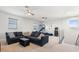 Spacious bonus room with comfortable seating, an arcade game and basketball hoop at 4790 Pastel Ct, Sarasota, FL 34240