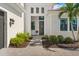 Inviting front entrance with a landscaped walkway and charming details at 4790 Pastel Ct, Sarasota, FL 34240