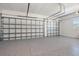 Spacious garage with epoxy flooring and two overhead doors at 4790 Pastel Ct, Sarasota, FL 34240