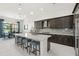 Modern kitchen with a large island, stainless steel appliances, and elegant pendant lighting at 4790 Pastel Ct, Sarasota, FL 34240