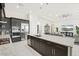 Beautiful kitchen featuring custom cabinetry, stainless steel appliances, and a large granite island at 4790 Pastel Ct, Sarasota, FL 34240
