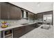 Well-equipped kitchen featuring stainless steel appliances, granite counters, and dark wood cabinetry at 4790 Pastel Ct, Sarasota, FL 34240