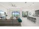Open concept living room offering serene water views and seamless access to the gourmet kitchen at 4790 Pastel Ct, Sarasota, FL 34240