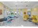 Bright lounge with seating, tile floors, and large windows that offer plenty of natural light and views of the pool at 4790 Pastel Ct, Sarasota, FL 34240