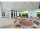 The outdoor patio features tables, chairs, and comfortable seating areas with views of the surrounding landscape at 4790 Pastel Ct, Sarasota, FL 34240