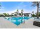 Resort-style pool with lounge chairs and umbrellas offering a relaxing oasis for residents and guests at 4790 Pastel Ct, Sarasota, FL 34240