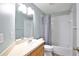 Bathroom with vanity, a large mirror, a combined tub and shower with a gray curtain at 4920 Breakwater Dr, Bradenton, FL 34203