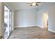 Spacious bedroom with sliding glass door and wood-look tile flooring at 4920 Breakwater Dr, Bradenton, FL 34203