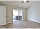 Bedroom with a ceiling fan and sliding door to outdoor hot tub area at 4920 Breakwater Dr, Bradenton, FL 34203