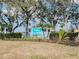 Community entrance sign for Sabal Harbour, featuring lush landscaping and mature trees in a well-maintained residential neighborhood at 4920 Breakwater Dr, Bradenton, FL 34203
