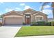 Charming single-story home featuring a well-manicured lawn, a two-car garage, and a welcoming front entrance at 4920 Breakwater Dr, Bradenton, FL 34203