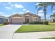 Charming single-story home featuring a well-manicured lawn and inviting curb appeal with a neutral color palette at 4920 Breakwater Dr, Bradenton, FL 34203