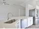 Modern kitchen island with stainless steel appliances and white countertops at 4920 Breakwater Dr, Bradenton, FL 34203