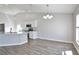 Bright kitchen features white cabinets, stainless steel appliances, and wood-look tile flooring at 4920 Breakwater Dr, Bradenton, FL 34203