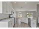 Bright kitchen features white cabinets, stainless steel appliances and breakfast bar at 4920 Breakwater Dr, Bradenton, FL 34203