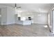 Spacious living room with wood-look flooring, high ceilings, and an open layout at 4920 Breakwater Dr, Bradenton, FL 34203
