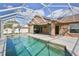 Gorgeous pool boasts a screened enclosure and covered patio at 4920 Breakwater Dr, Bradenton, FL 34203
