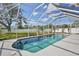 Sparkling pool is surrounded by a screened enclosure offering pristine views of the backyard at 4920 Breakwater Dr, Bradenton, FL 34203