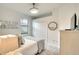 Comfortable bedroom featuring a large window, neutral colors, carpet flooring and a mirrored sliding door closet at 5433 Mystic Water Cv, Lakewood Ranch, FL 34211