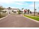 Community clubhouse featuring decorative seasonal decor and a well-manicured landscape at 5433 Mystic Water Cv, Lakewood Ranch, FL 34211