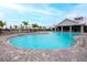 Community pool featuring a large pool area and palm tree landscaping at 5433 Mystic Water Cv, Lakewood Ranch, FL 34211
