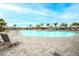 Community pool featuring a large pool area, ample seating, and beautiful landscaping at 5433 Mystic Water Cv, Lakewood Ranch, FL 34211