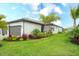 Beautiful home with lush landscaping, healthy green grass and lovely palms at 5433 Mystic Water Cv, Lakewood Ranch, FL 34211