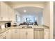 Kitchen with stainless steel appliances that opens up to the living room at 5433 Mystic Water Cv, Lakewood Ranch, FL 34211