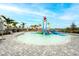 Community splash pad with a variety of features and ample seating at 5433 Mystic Water Cv, Lakewood Ranch, FL 34211