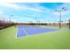 Tennis courts featuring well-maintained courts, lighting, and professional surface at 5433 Mystic Water Cv, Lakewood Ranch, FL 34211