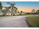 Scenic view of villas with lush lawns and palm trees showcasing the community's serene atmosphere at 5556 Country Club Way # 5556, Sarasota, FL 34243