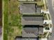 An aerial view shows roof and backyard, displaying privacy fencing and proximity to a pond, enhancing property appeal at 5675 Equator Ct, Nokomis, FL 34275