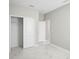 An inviting bedroom with closet, marble flooring, and white doors that create a clean aesthetic at 5675 Equator Ct, Nokomis, FL 34275