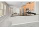 Kitchen featuring granite countertops, stainless steel appliances, and modern open floor plan at 5675 Equator Ct, Nokomis, FL 34275
