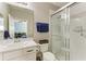 Clean bathroom featuring a glass door shower and a single sink vanity with an ensuite at 5709 Sunflower Cir, Sarasota, FL 34238