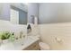 Charming bathroom featuring shiplap walls, gold hardware, and modern vanity at 5709 Sunflower Cir, Sarasota, FL 34238