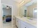 Clean and elegant bathroom with double sinks and quartz countertops at 5709 Sunflower Cir, Sarasota, FL 34238