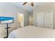 Bright bedroom with a TV and an ensuite bathroom at 5709 Sunflower Cir, Sarasota, FL 34238