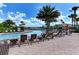 Beautiful community pool with lounge chairs and tables offering a perfect space for relaxation at 5709 Sunflower Cir, Sarasota, FL 34238