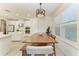 Bright dining area featuring modern lighting and seamless access to the kitchen at 5709 Sunflower Cir, Sarasota, FL 34238