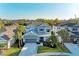 Two-story home with a gray facade, well-manicured lawn, and a two-car garage at 5709 Sunflower Cir, Sarasota, FL 34238