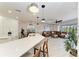 Open kitchen featuring a view of the living room, a backyard pool, and an inviting atmosphere at 5709 Sunflower Cir, Sarasota, FL 34238