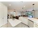 Open-concept kitchen with view to living area and a backyard pool, promoting a relaxed lifestyle at 5709 Sunflower Cir, Sarasota, FL 34238